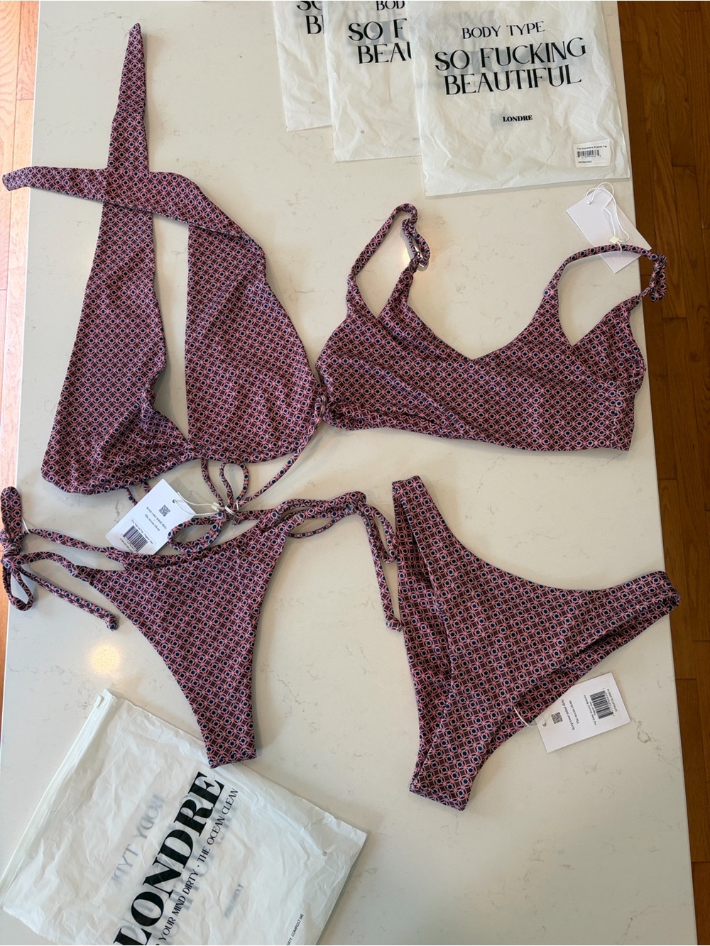 Four pieces!!! Mix and match two tops and two bottoms. All NWT.
